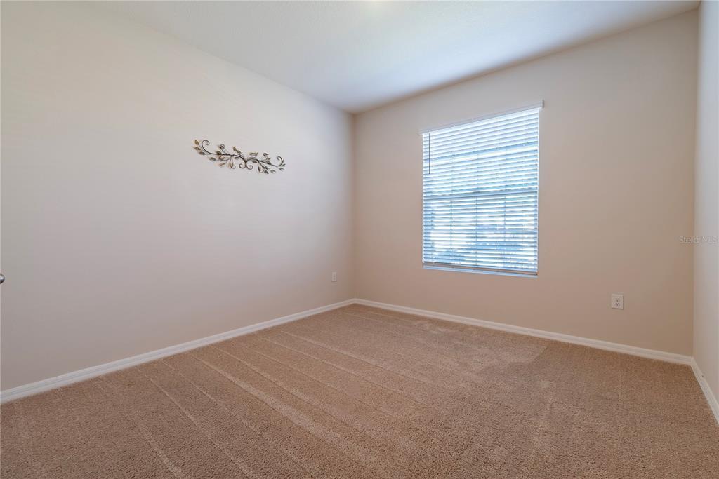 8284 Southwest 59th Terrace Ocala, FL 34476 - Photo 32 of 63 an empty room with a window