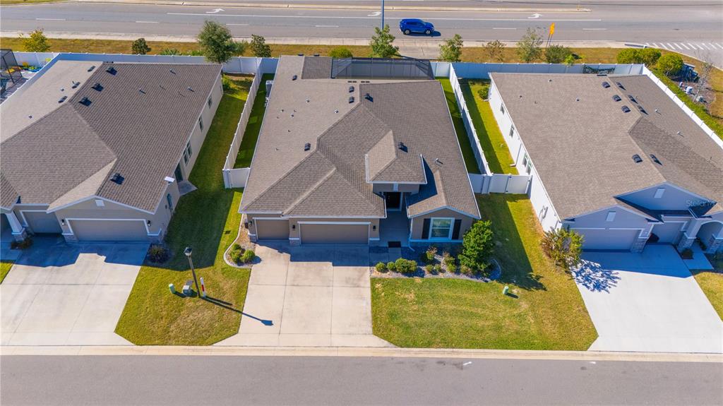 8284 Southwest 59th Terrace Ocala, FL 34476 - Photo 56 of 63 an aerial view of residential houses with outdoor space and swimming pool