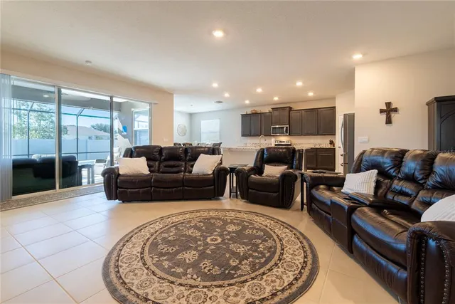 a spacious bedroom with a bed and a couch