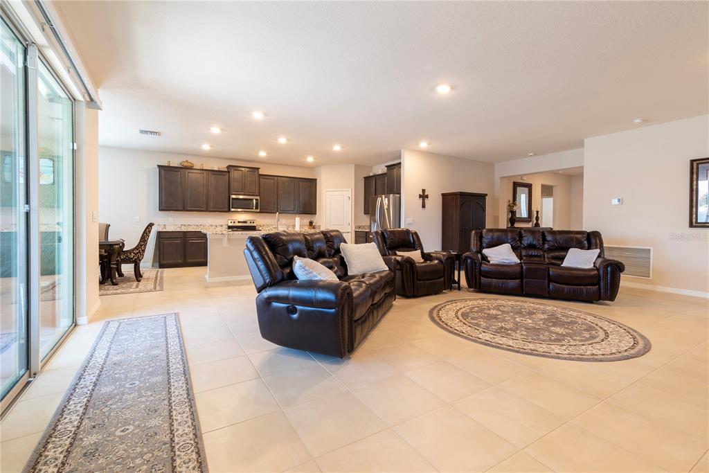 8284 Southwest 59th Terrace Ocala, FL 34476 - Photo 8 of 63 a living room with furniture and a couch