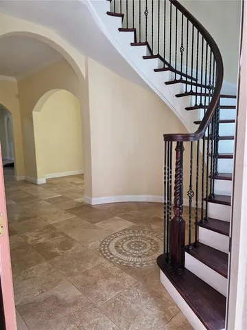 a view of entryway with wooden floor