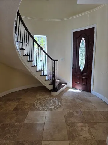 a view of an entryway with wooden floor