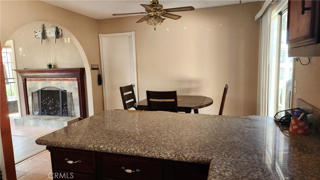 18133 10th Street Bloomington, CA 92316 - Photo 4 of 15 a living room with furniture and a fireplace