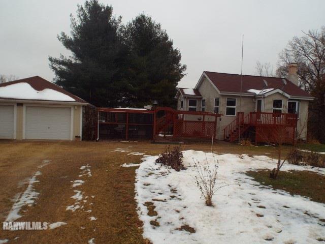 8011 Haas Road Savanna, IL 61074 - Photo 17 of 36 a view of a house with a yard covered in snow