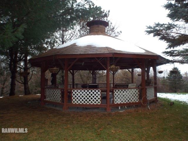 8011 Haas Road Savanna, IL 61074 - Photo 22 of 36 a couple of table and chairs under an umbrella