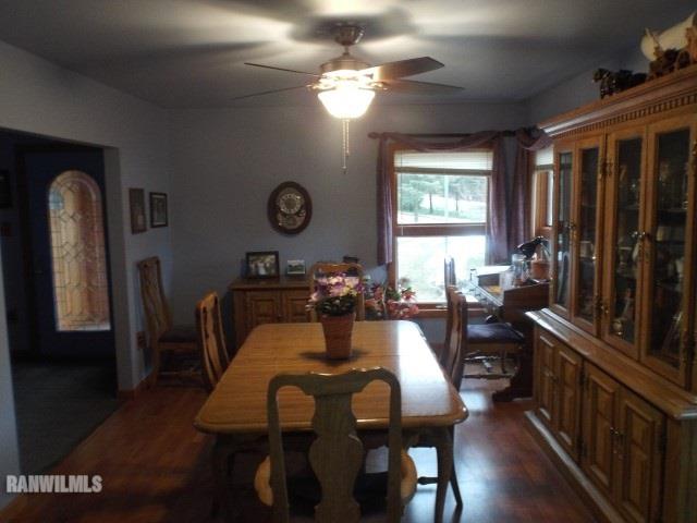 8011 Haas Road Savanna, IL 61074 - Photo 5 of 36 a view of a dining room with furniture window and wooden floor