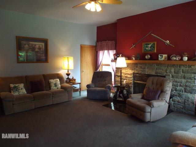 8011 Haas Road Savanna, IL 61074 - Photo 6 of 36 a living room with furniture and a fireplace