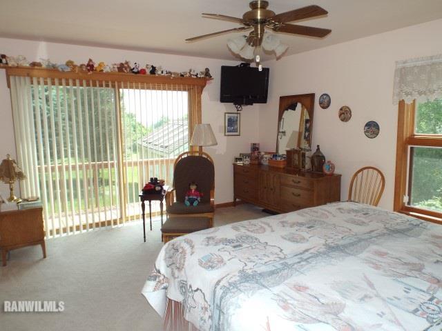 8011 Haas Road Savanna, IL 61074 - Photo 7 of 36 a bedroom with a bed and a large window