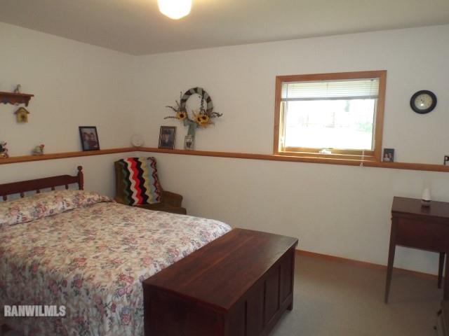 8011 Haas Road Savanna, IL 61074 - Photo 10 of 36 a bedroom with a bed and a window