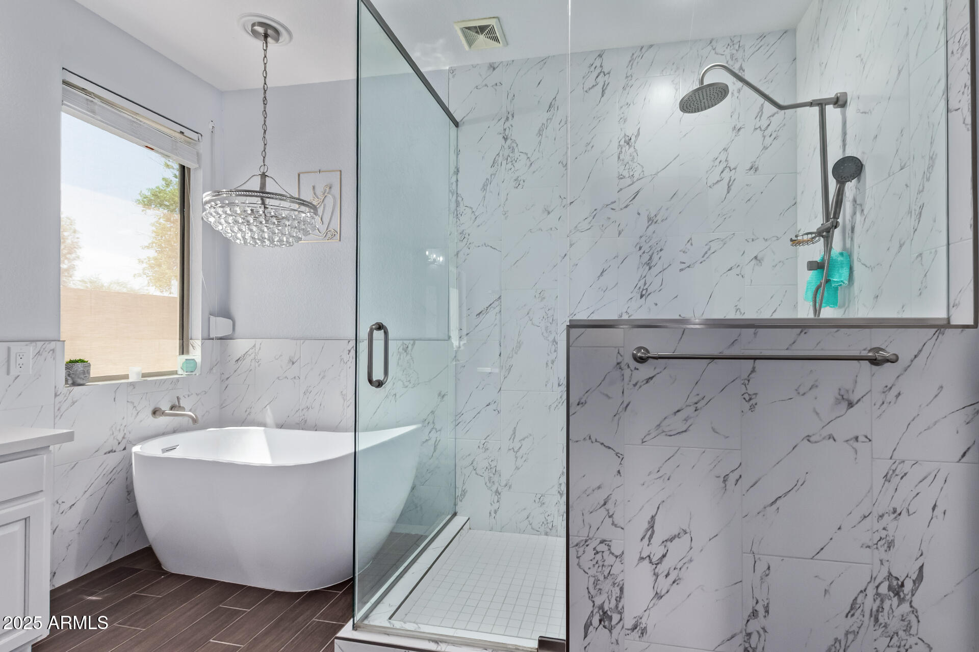2225 West Carter Road Phoenix, AZ 85041 - Photo 18 of 33 a bathroom with a bathtub and shower