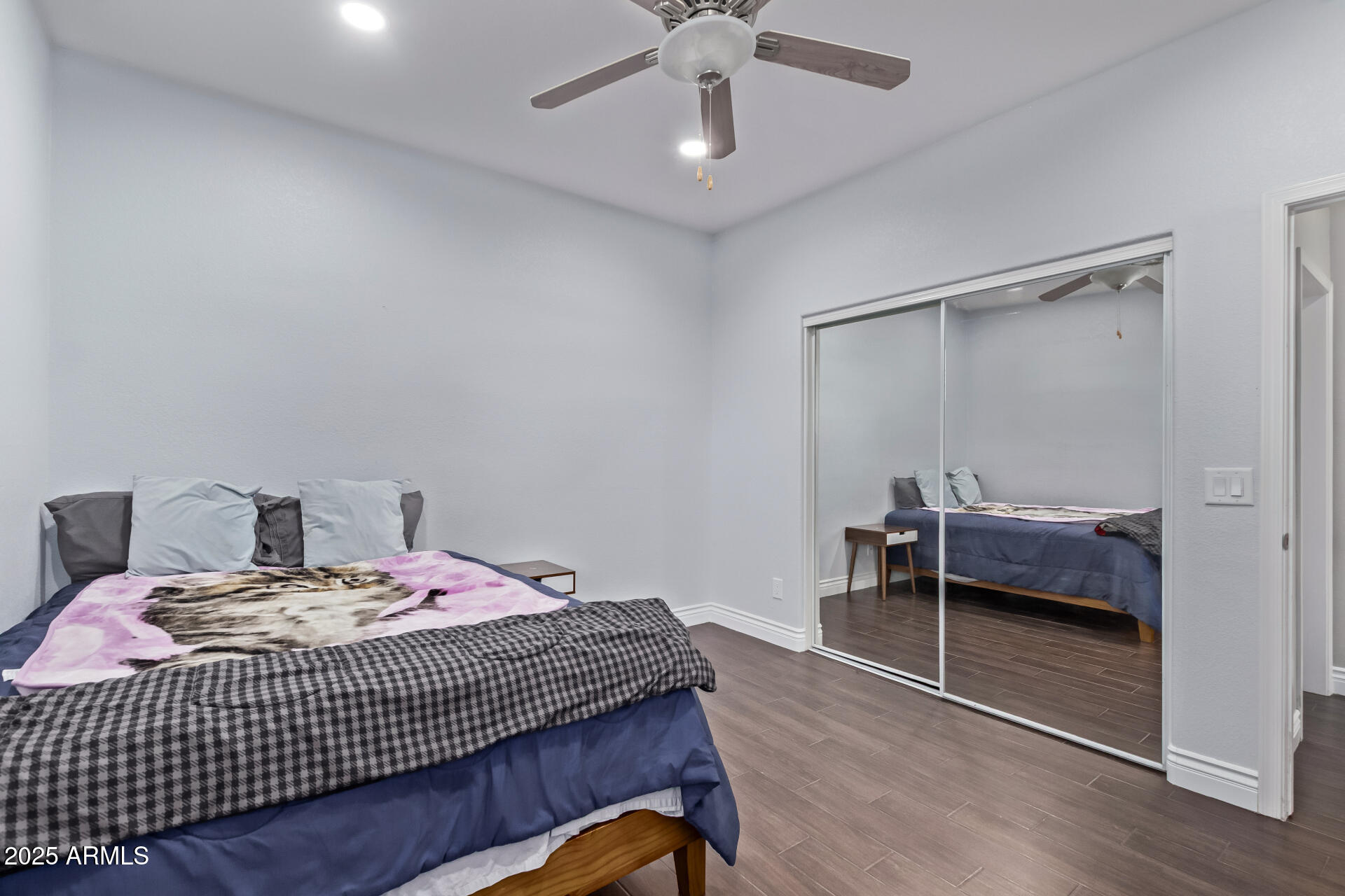 2225 West Carter Road Phoenix, AZ 85041 - Photo 21 of 33 a bedroom with a bed and a table