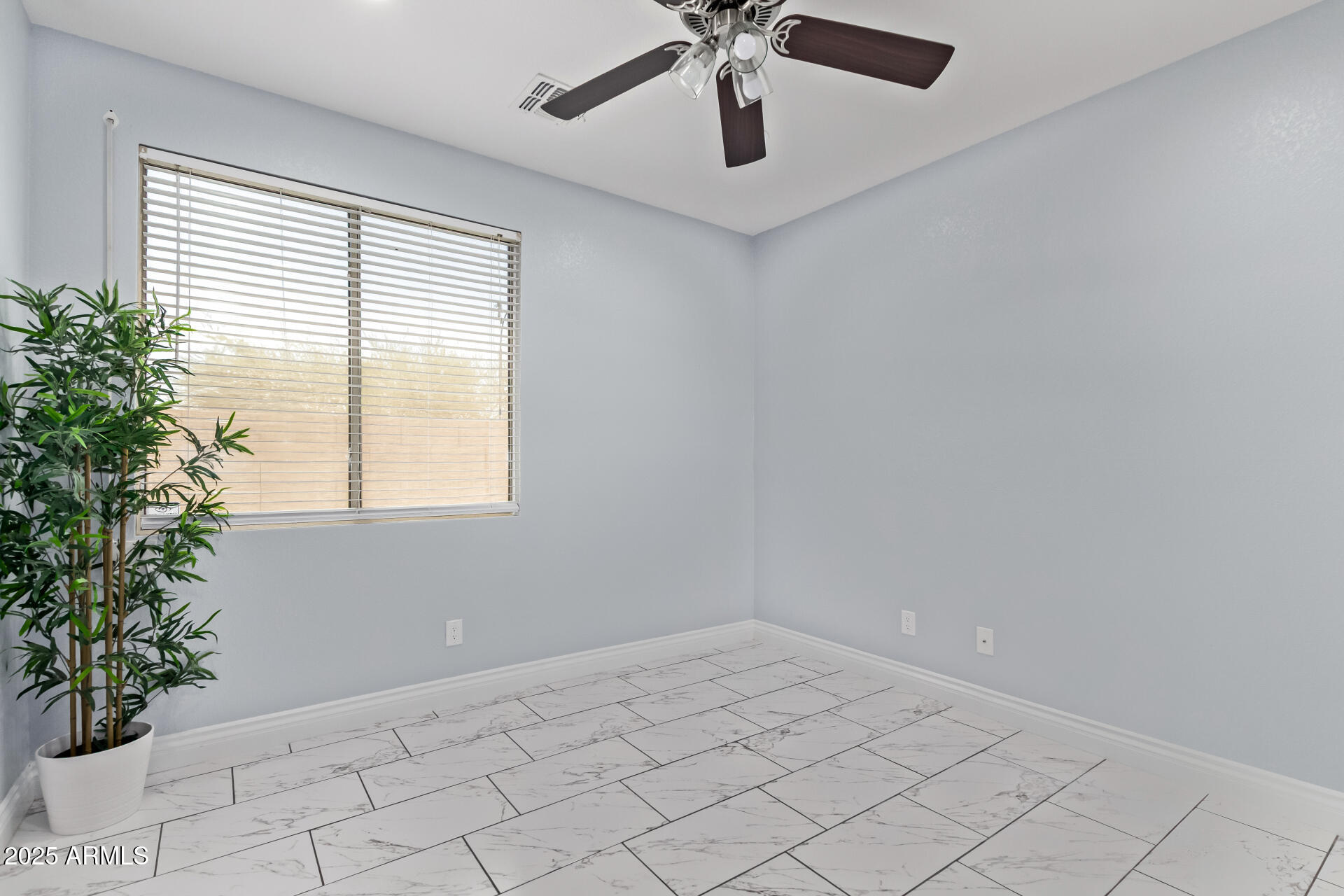 2225 West Carter Road Phoenix, AZ 85041 - Photo 24 of 33 a view of an empty room with a window