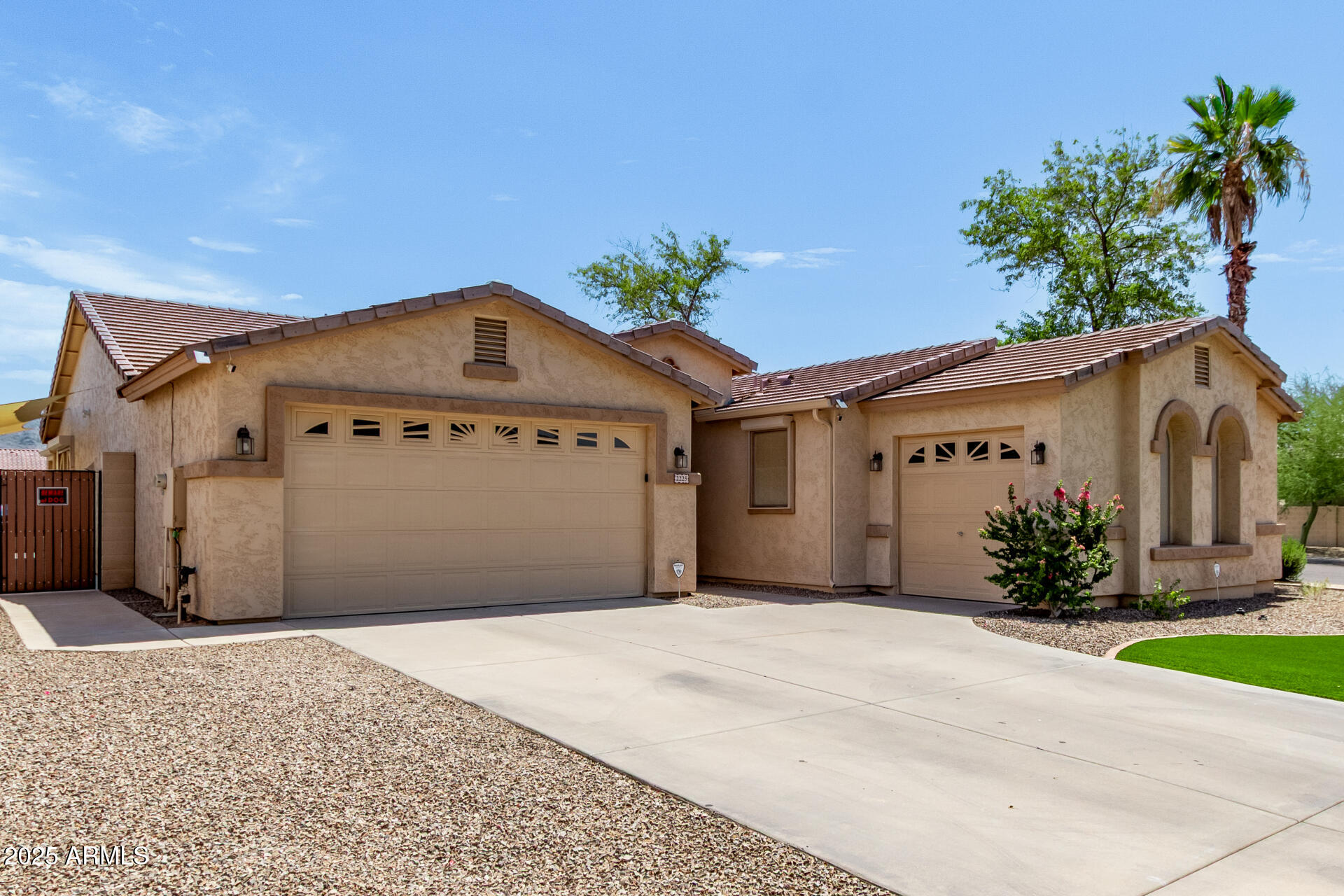 2225 West Carter Road Phoenix, AZ 85041 - Photo 3 of 33 a front view of a house with a garage