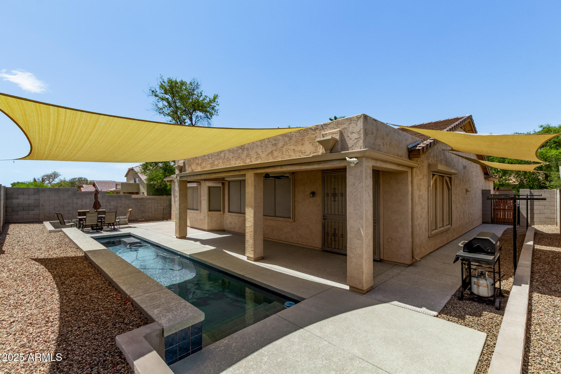 2225 West Carter Road Phoenix, AZ 85041 - Photo 33 of 33 a view of a house with tub and chairs