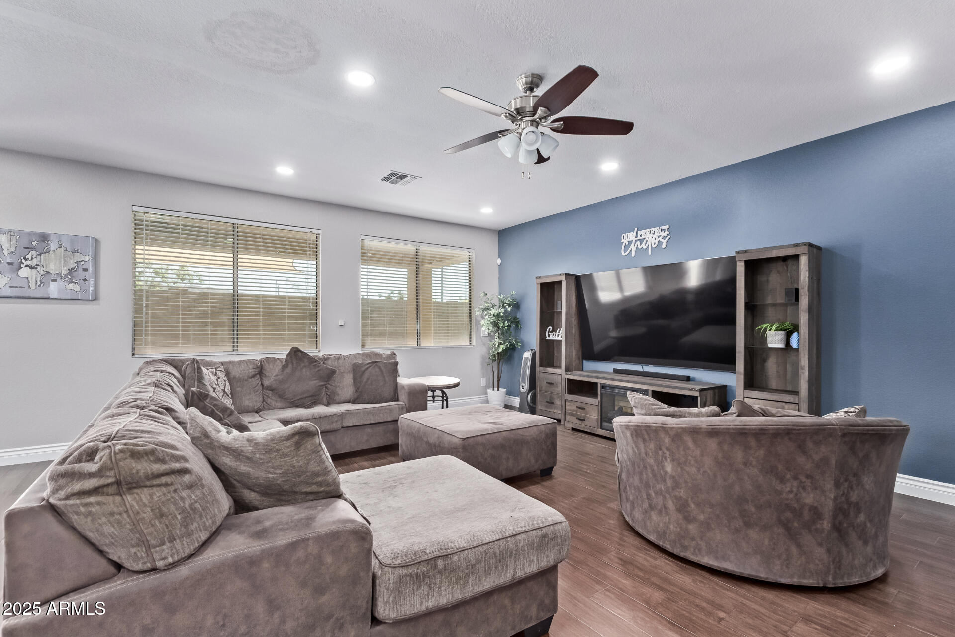 2225 West Carter Road Phoenix, AZ 85041 - Photo 7 of 33 a living room with furniture and a flat screen tv