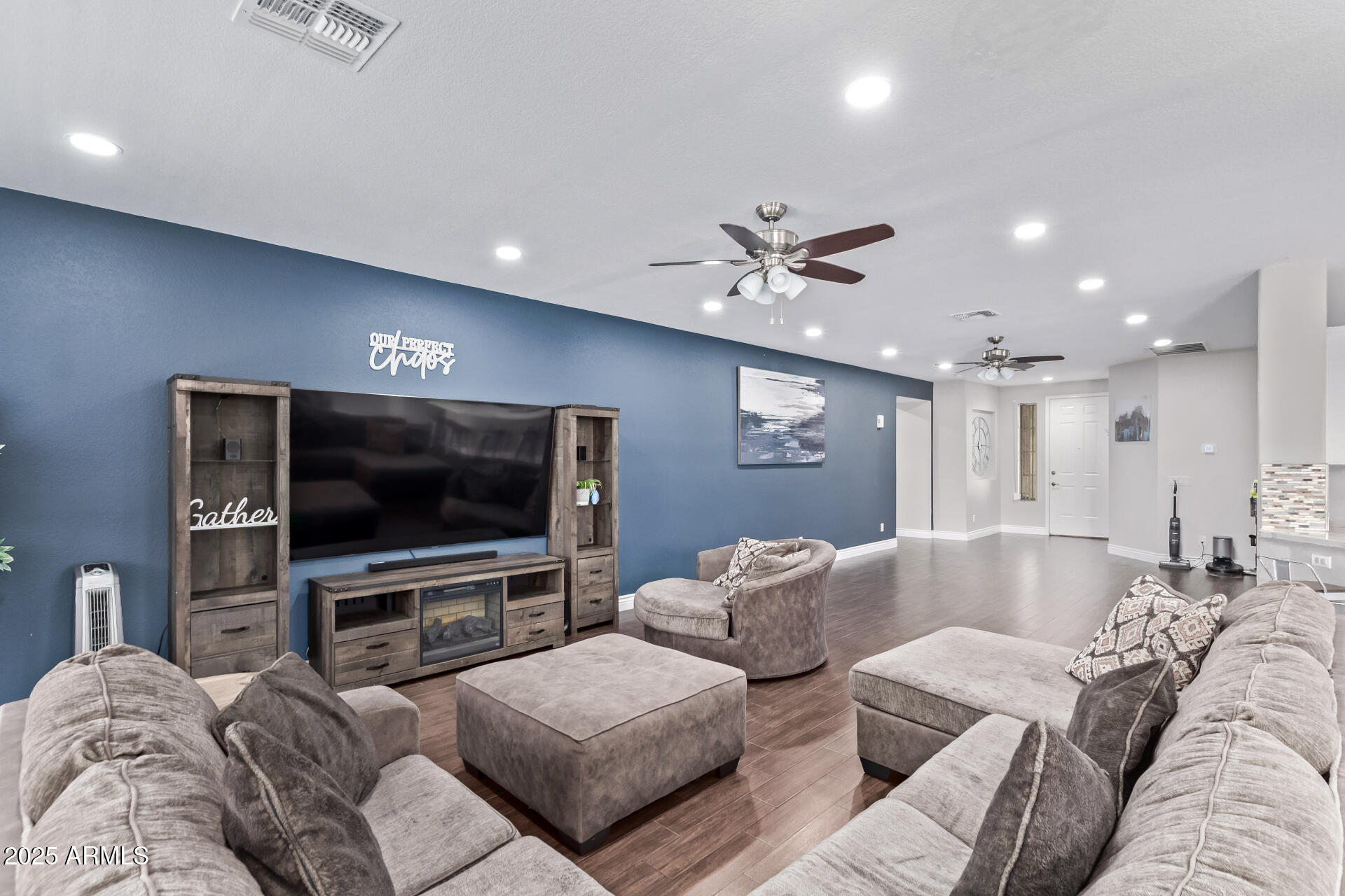 2225 West Carter Road Phoenix, AZ 85041 - Photo 9 of 33 a living room with furniture and a flat screen tv