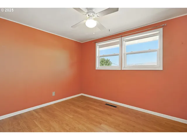a bathroom with a granite countertop sink toilet a mirror and shower