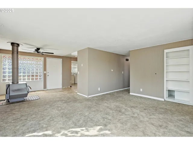 a view of an empty room and window