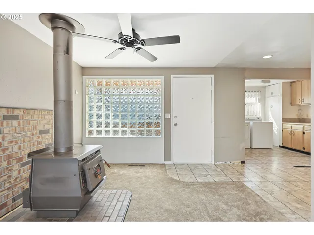 a kitchen with a sink a counter top space and cabinets