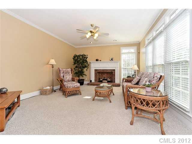 109 Fairwind Court Fort Mill, SC 29708 - Photo 8 of 16 a living room with furniture a fireplace and a large window