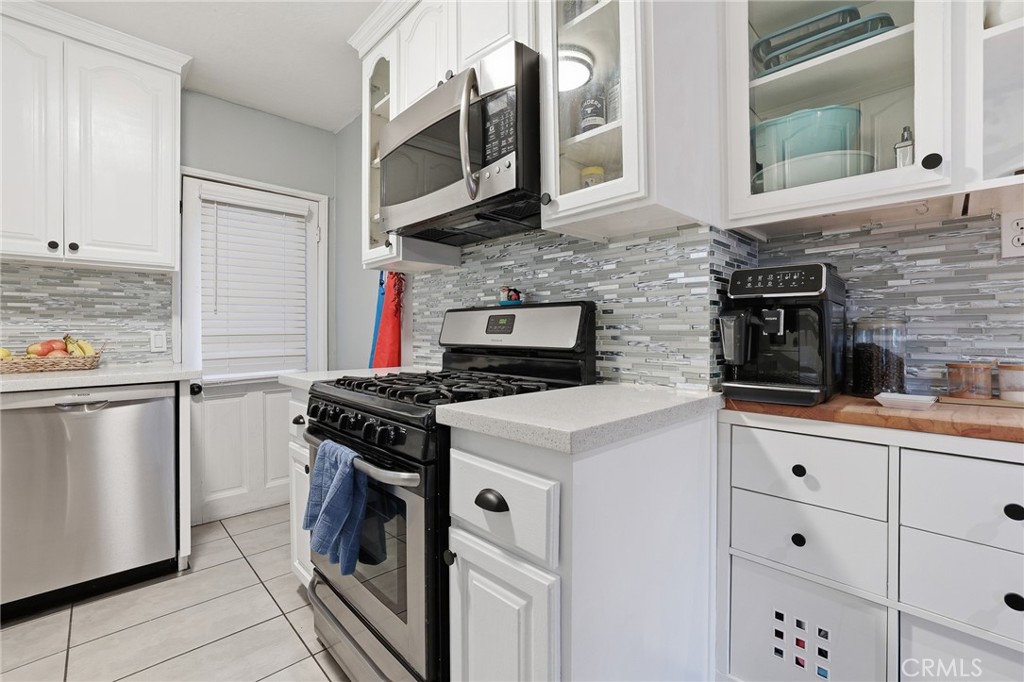 1954 Addison Way Los Angeles, CA 90041 - Photo 13 of 40 a kitchen with stainless steel appliances granite countertop a stove and a refrigerator
