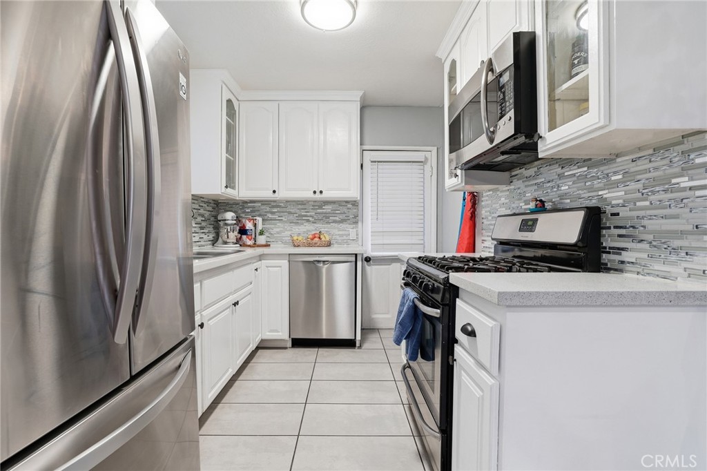 1954 Addison Way Los Angeles, CA 90041 - Photo 14 of 40 a kitchen with stainless steel appliances granite countertop a refrigerator a stove and a sink