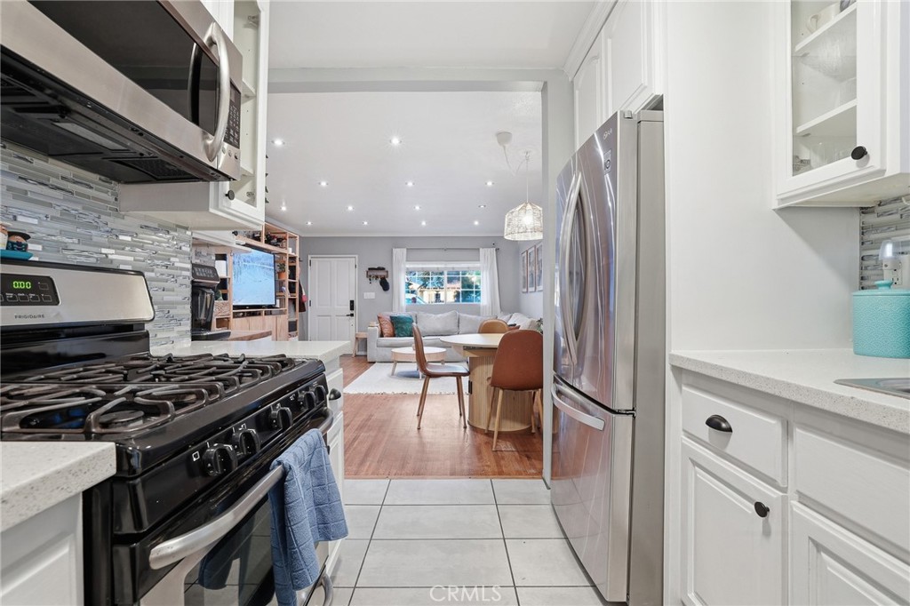 1954 Addison Way Los Angeles, CA 90041 - Photo 15 of 40 a kitchen with stainless steel appliances granite countertop a stove a sink and a refrigerator
