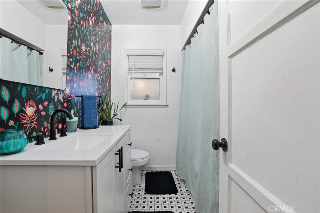 1954 Addison Way Los Angeles, CA 90041 - Photo 19 of 40 a bathroom with a sink a vanity and a mirror