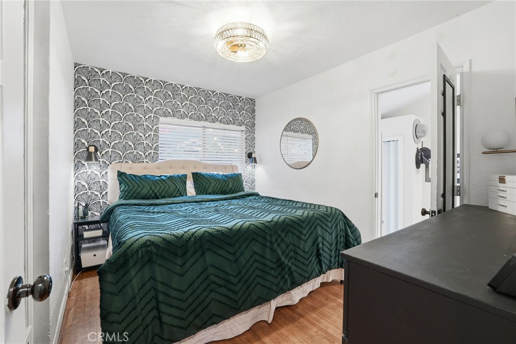 1954 Addison Way Los Angeles, CA 90041 - Photo 24 of 40 a bedroom with a bed and a chandelier