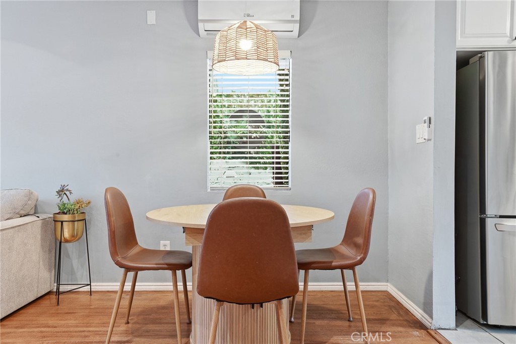 1954 Addison Way Los Angeles, CA 90041 - Photo 10 of 40 a view of a dining room with furniture and wooden floor