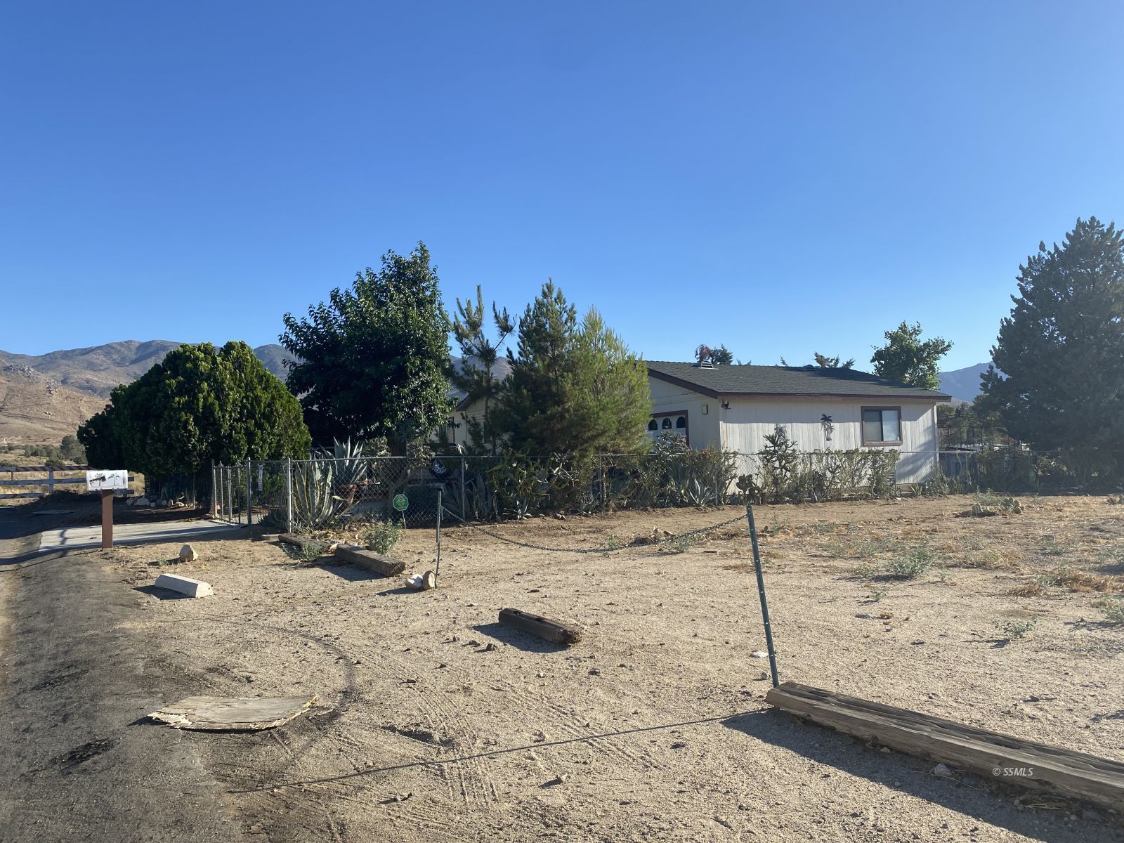 9003 Apache Drive Weldon, CA 93283 - Photo 2 of 5 a backyard of a house with yard and covered with snow