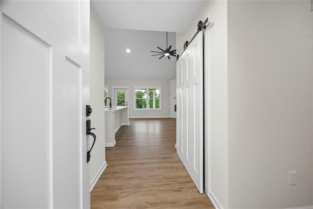 653 Racetrack Road Toccoa, GA 30577 - Photo 2 of 7 a view of a hallway with wooden floor and staircase