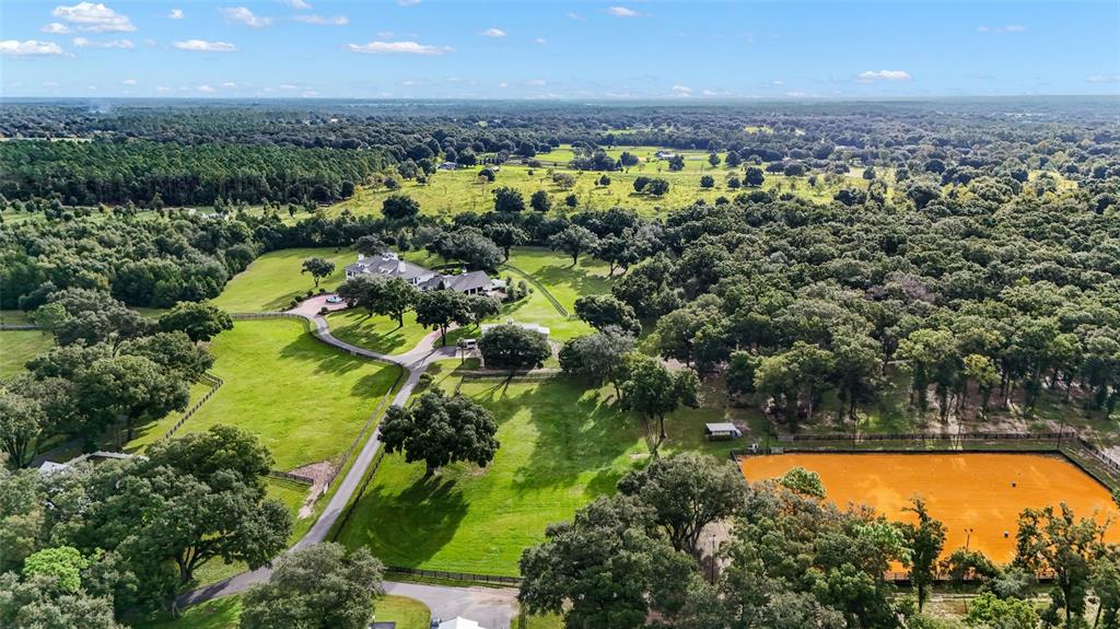 22422 Lake Seneca Road Eustis, FL 32736 - Photo 1 of 1 Arena from the house close to barn