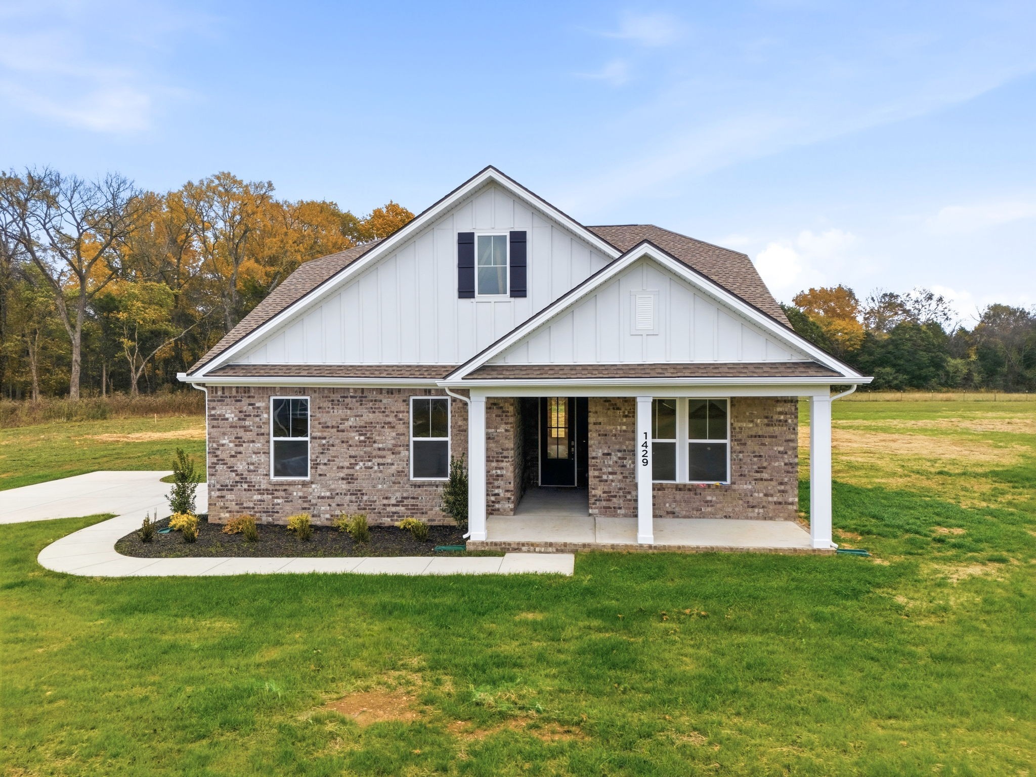 1429 Charles Drive Chapel Hill, TN 37034 - Photo 1 of 24 a front view of a house with a garden and yard