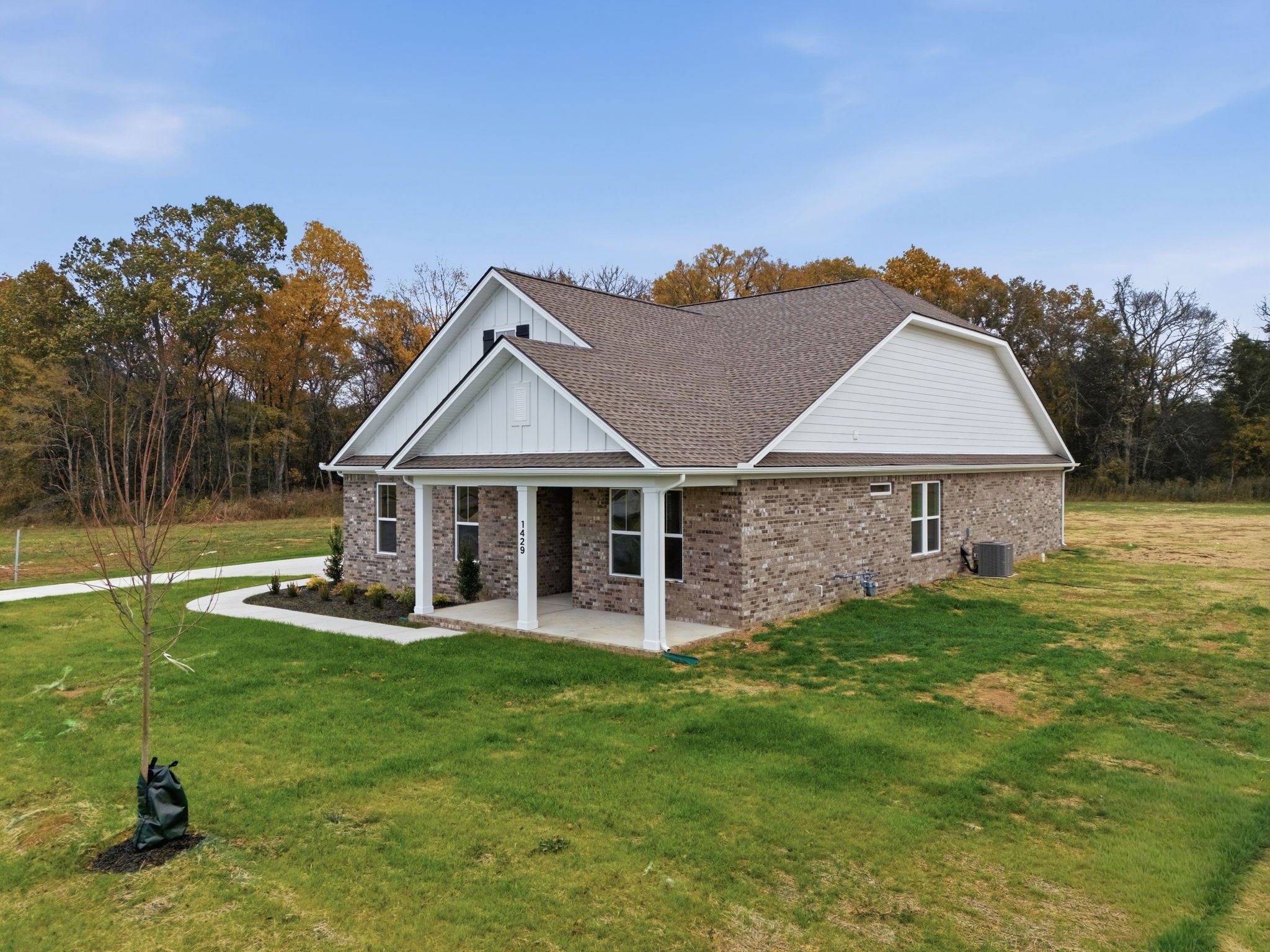 1429 Charles Drive Chapel Hill, TN 37034 - Photo 2 of 24 a front view of a house with a porch and a yard
