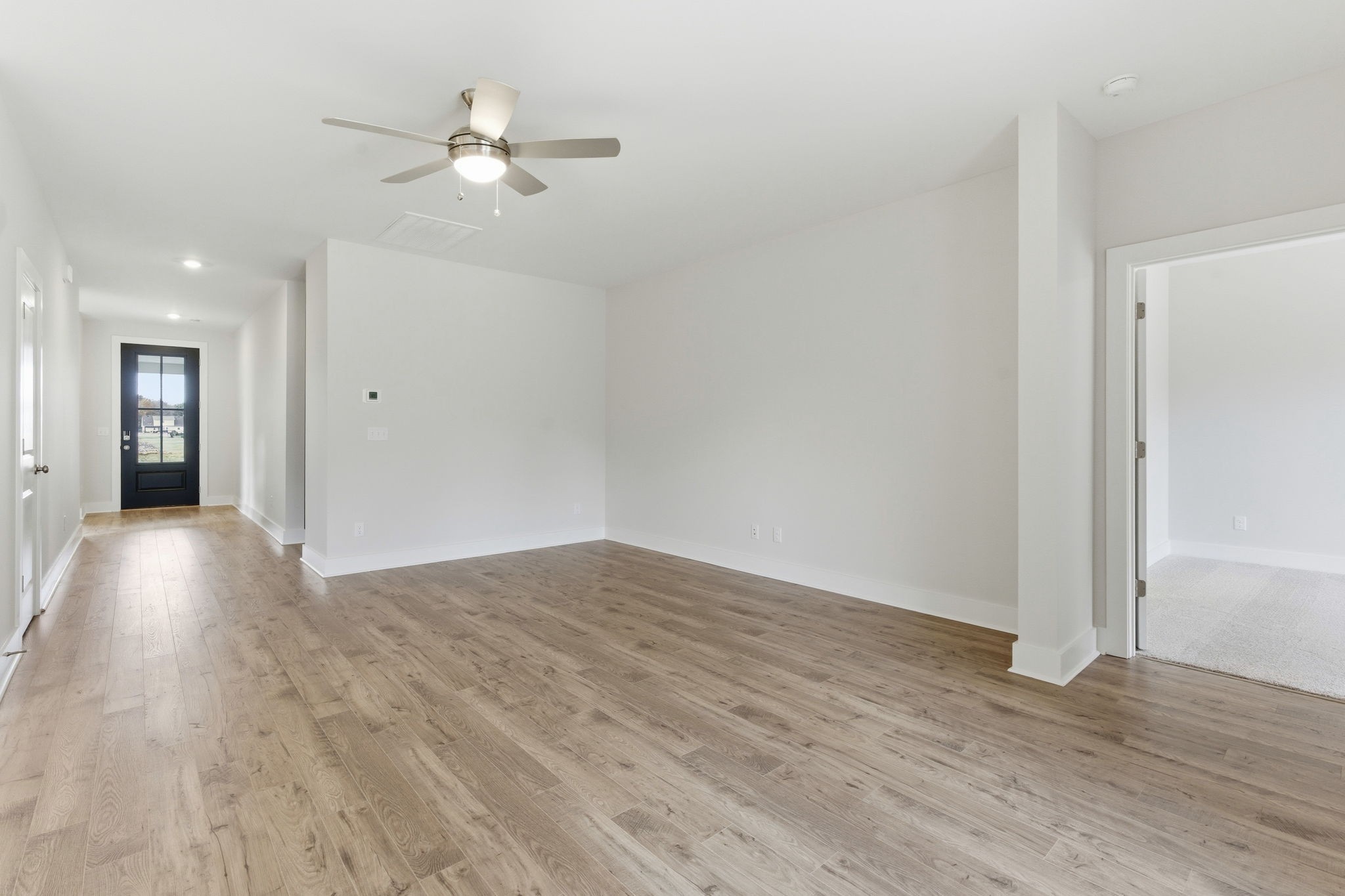 1429 Charles Drive Chapel Hill, TN 37034 - Photo 24 of 24 an empty room with wooden floor and ceiling fan