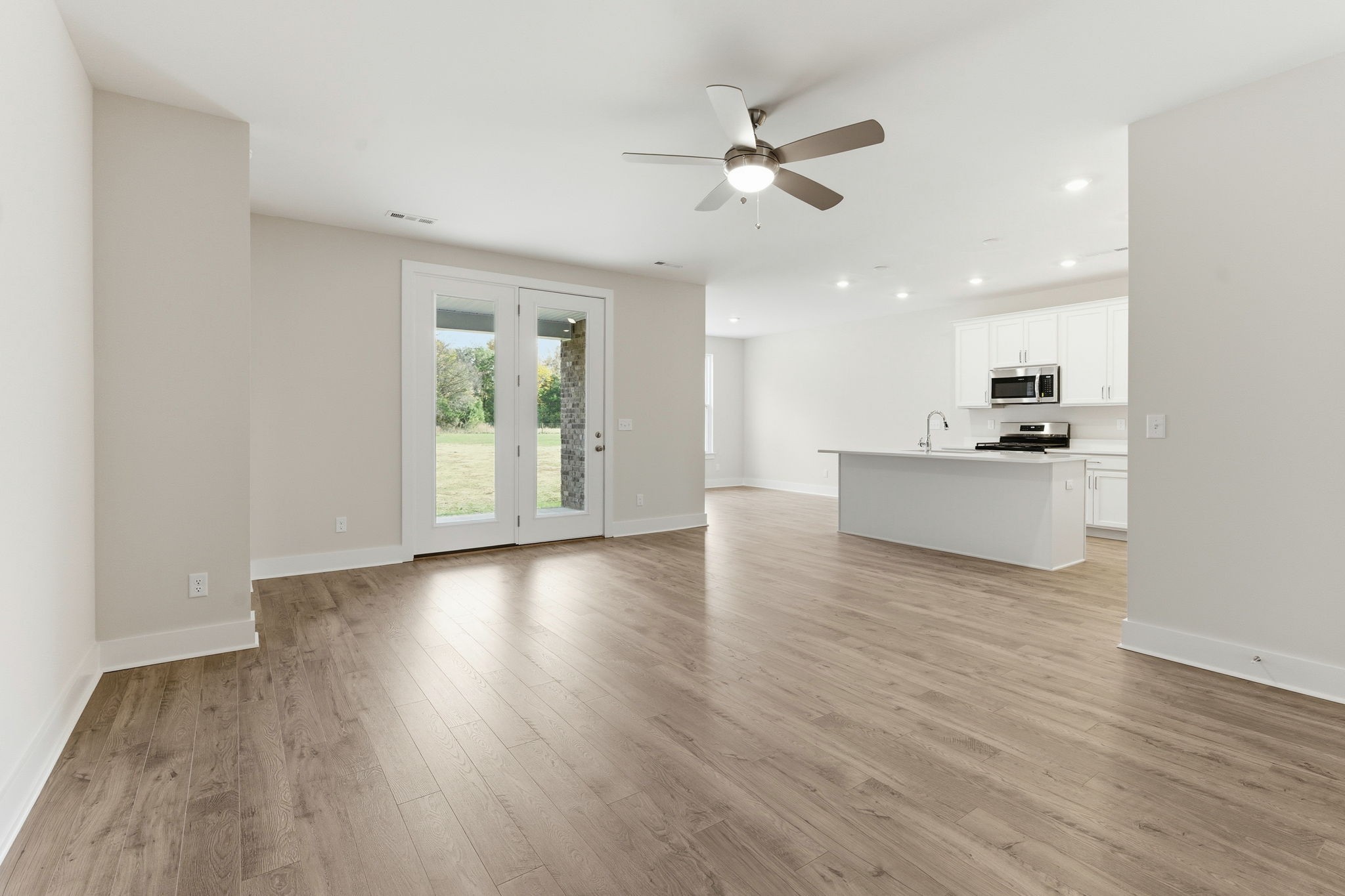1429 Charles Drive Chapel Hill, TN 37034 - Photo 5 of 24 a view of a kitchen with a sink dishwasher cabinets and wooden floor