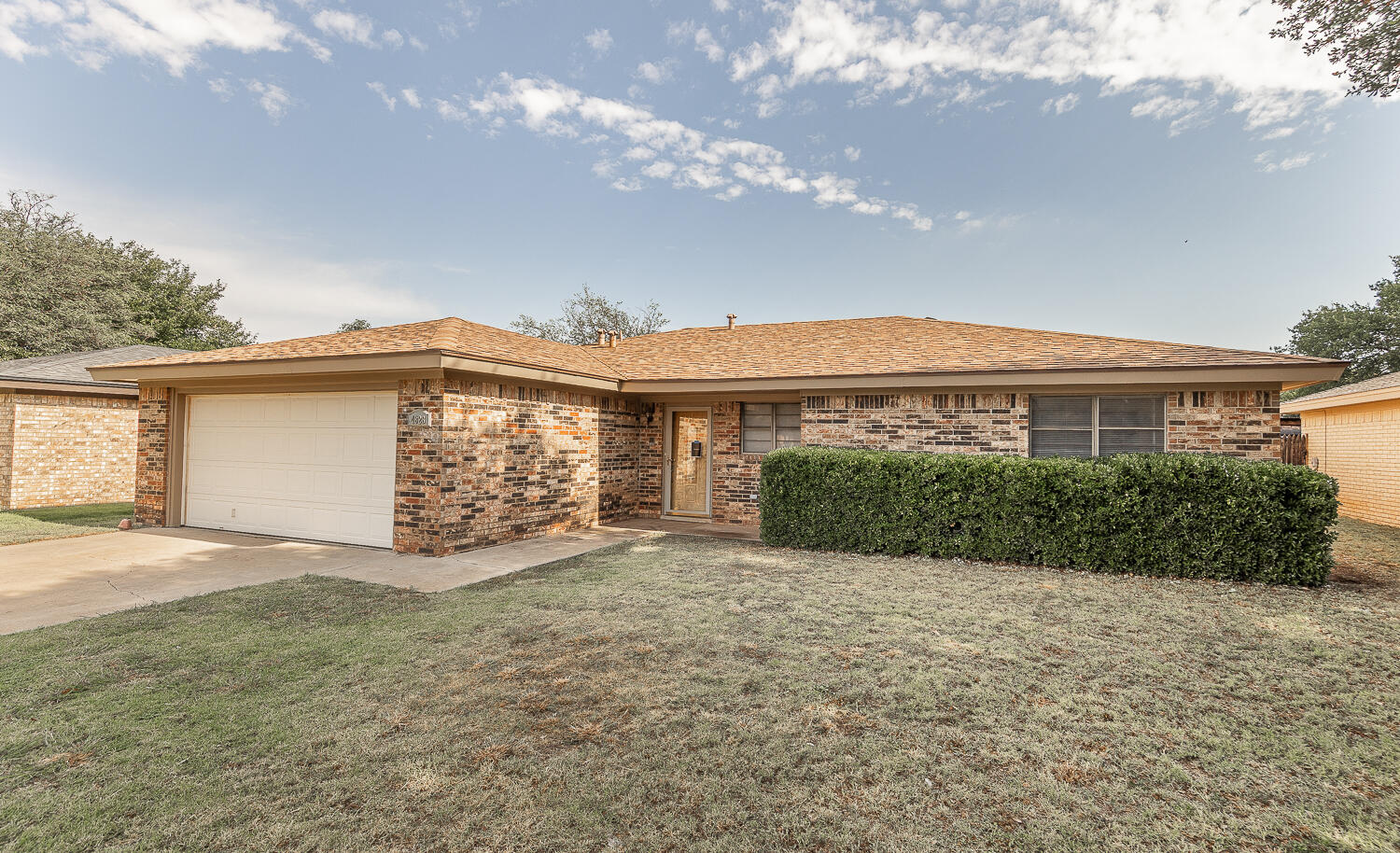 4828 73rd Street Lubbock, TX 79424 - Photo 23 of 23 a view of a house with a large tree and a yard