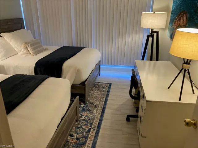 a view of a balcony with furniture and a lamp