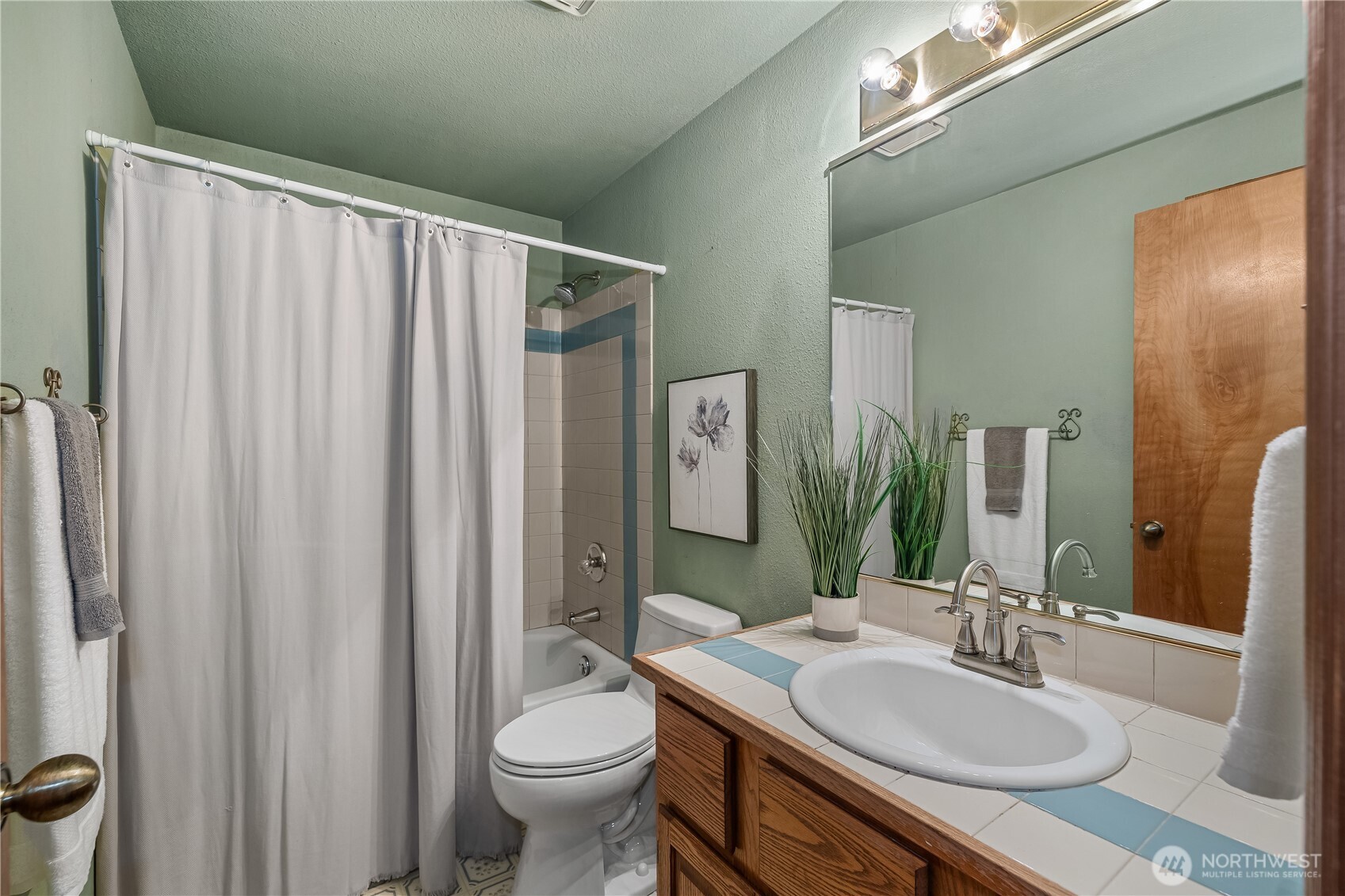 233 Clay Court Southeast Olympia, WA 98513 - Photo 26 of 33 a bathroom with a sink toilet and shower