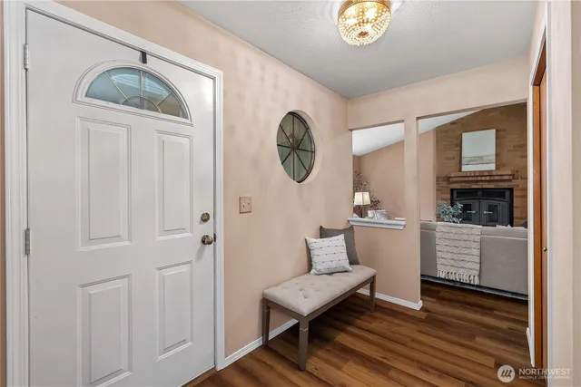 a view of a livingroom with furniture and wooden floor