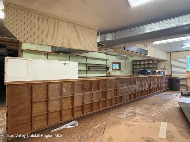 a room with lots of wooden cabinets