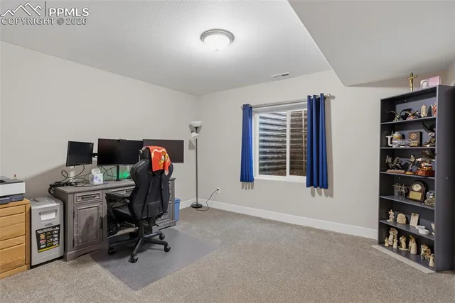 a view of a livingroom with furniture and a flat screen tv