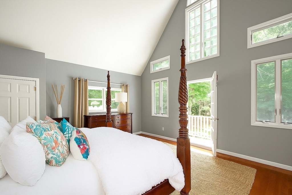 480 Ferry Street Marshfield, MA 02050 - Photo 11 of 34 a bedroom with a large bed and a large window