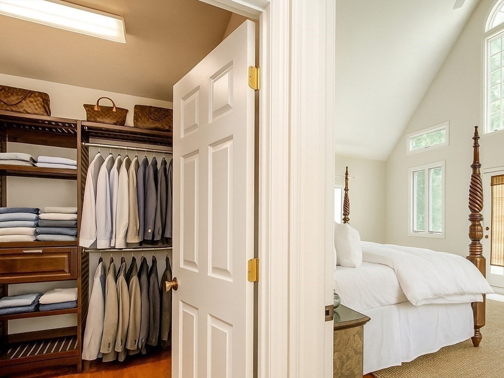 480 Ferry Street Marshfield, MA 02050 - Photo 12 of 34 a view of walk in closet with clothes and shoes