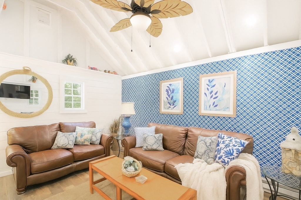 480 Ferry Street Marshfield, MA 02050 - Photo 30 of 34 a living room with a couch and a table