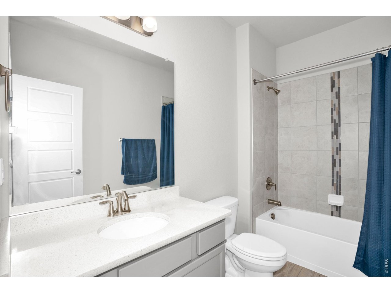 864 Frst Cyn Road Severance, CO 80550 - Photo 26 of 39 a bathroom with a granite countertop sink toilet tub and shower