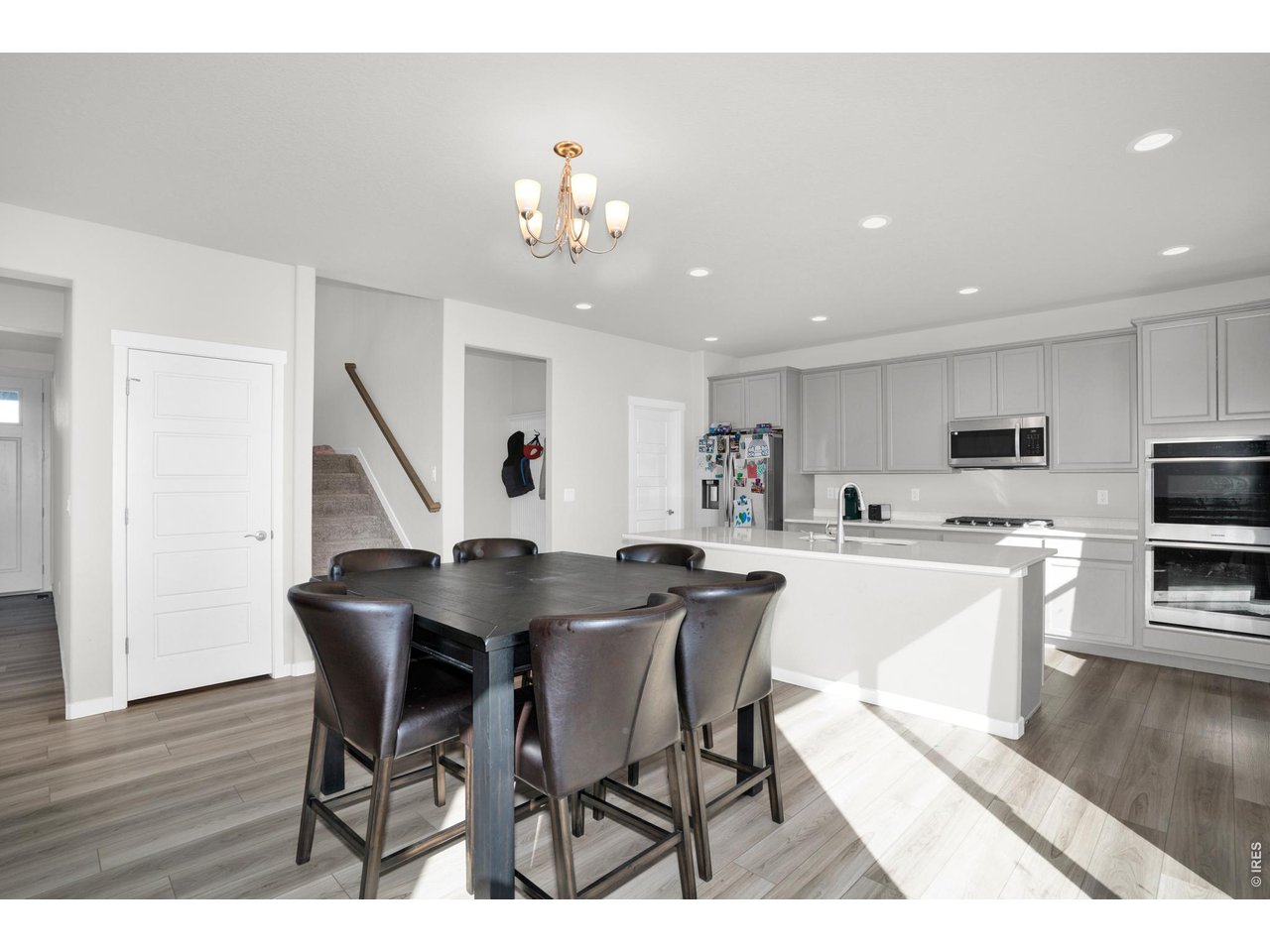 864 Frst Cyn Road Severance, CO 80550 - Photo 4 of 39 a view of a dining room with furniture and wooden floor
