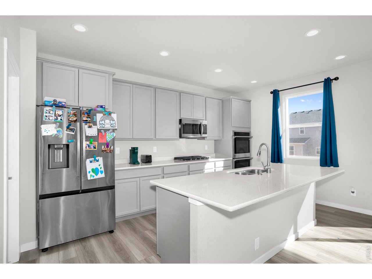 864 Frst Cyn Road Severance, CO 80550 - Photo 8 of 39 a white kitchen with refrigerator and a stove