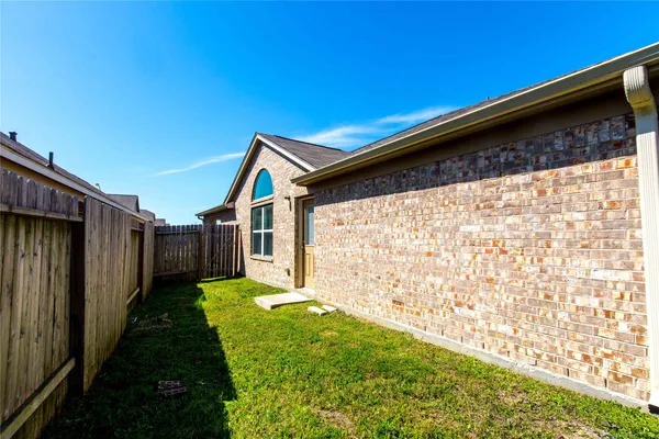 a backyard of a house with a garden